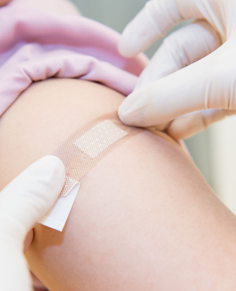Woman Getting a Band-Aid